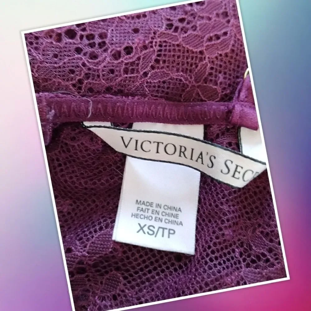 Victoria Secret XS maroon lace top. Features lace tie on the back, gold accent